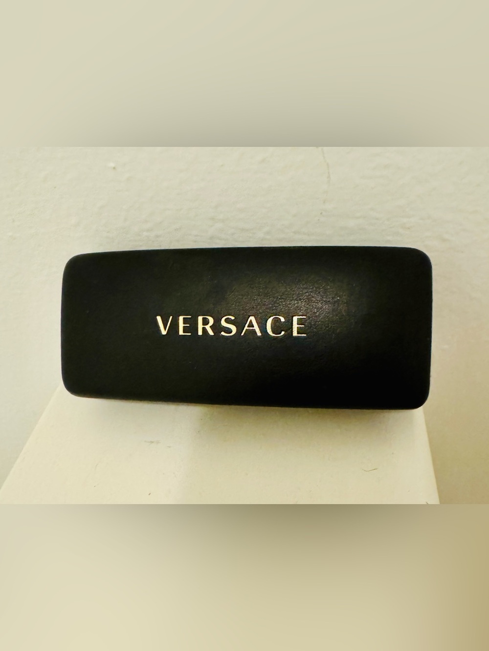 Versace. Black rigid leather Versace case with gold lettering (for sunglasses or